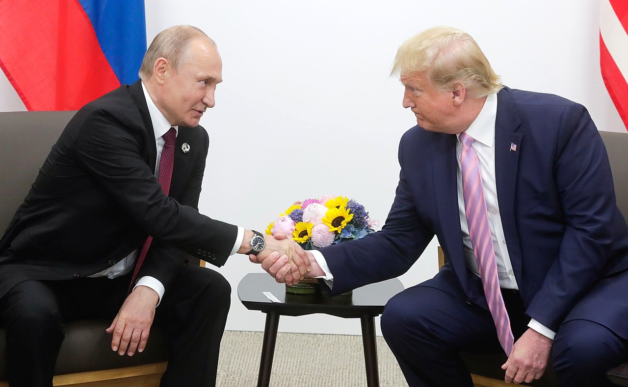 Putin and Trump shake hands